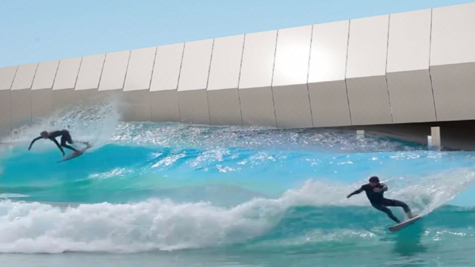 Surfers riding an artificial wave inside an Olas Surfing Technologies pool